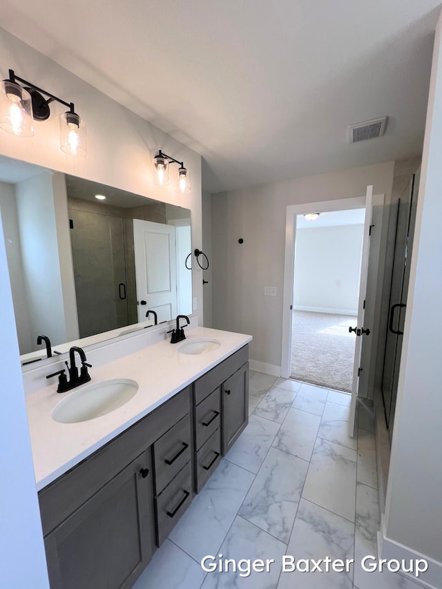 11328 Shoreline Dr Unit 118, Allendale, MI 49401 - full bath featuring marble finish floors, double vanity, a stall shower, and baseboards