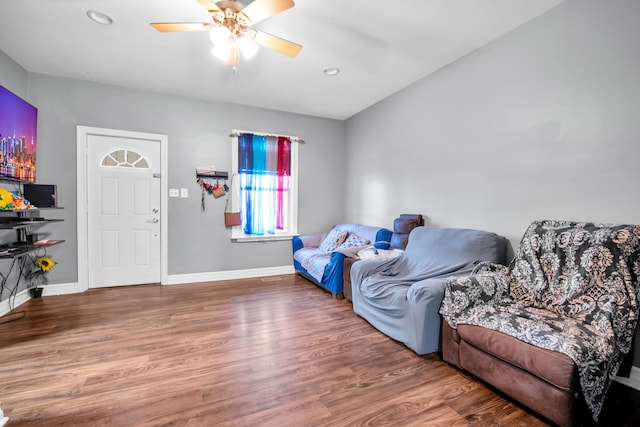 living area with recessed lighting, a ceiling fan, baseboards, and wood finished floors