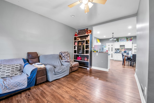 living area featuring recessed lighting, baseboards, a ceiling fan, and wood finished floors