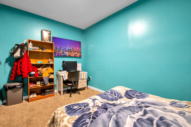 carpeted bedroom with baseboards