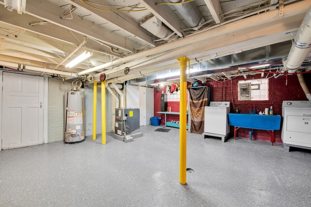 unfinished below grade area featuring washer / dryer, heating unit, water heater, and a sink