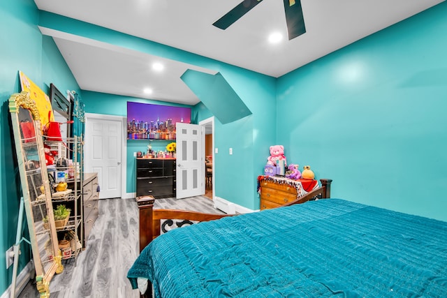 bedroom with recessed lighting, wood finished floors, baseboards, and ceiling fan