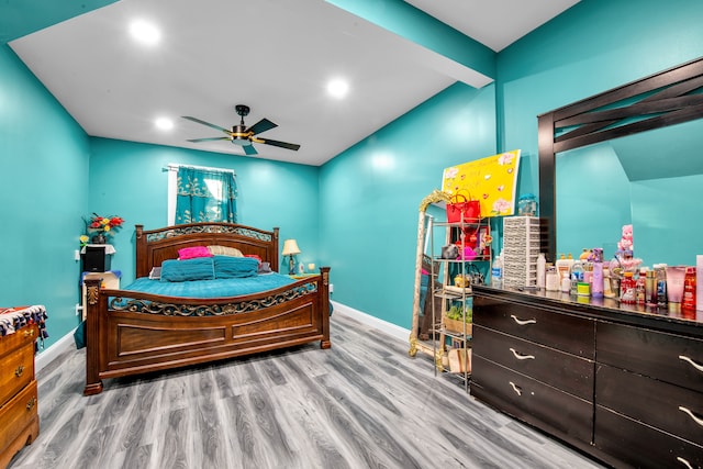 bedroom featuring vaulted ceiling with beams, ceiling fan, baseboards, recessed lighting, and wood finished floors