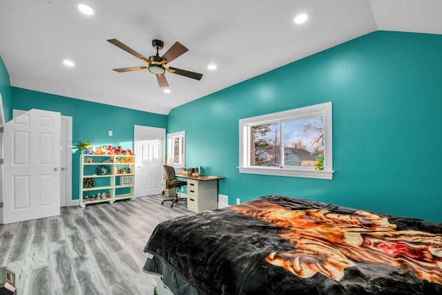 bedroom with recessed lighting, lofted ceiling, wood finished floors, and a ceiling fan