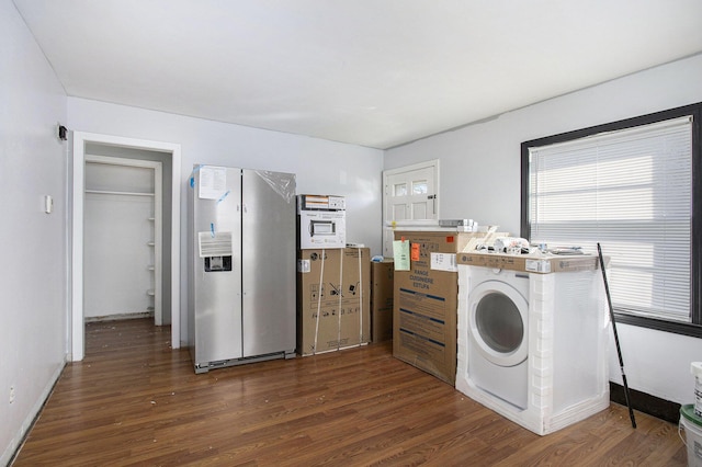 laundry area featuring washer / dryer, dark wood-style floors, baseboards, and laundry area