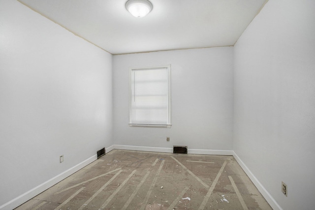 unfurnished room featuring visible vents and baseboards