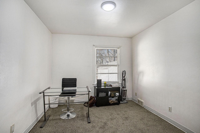 carpeted office with visible vents and baseboards