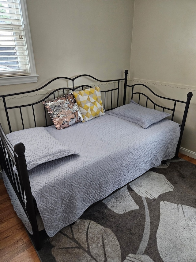 bedroom with wood finished floors