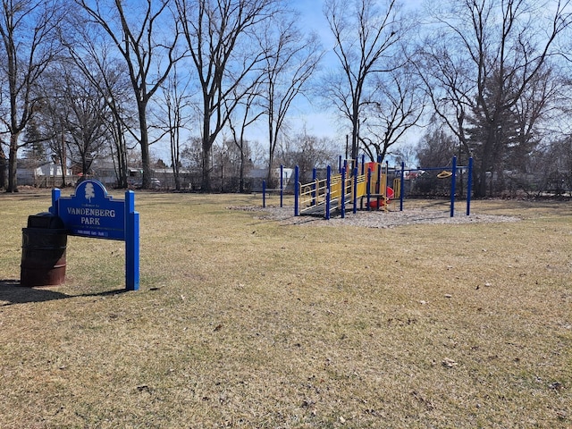 community jungle gym with a lawn