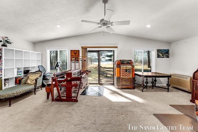 carpeted dining area with recessed lighting, lofted ceiling, ceiling fan, and radiator heating unit