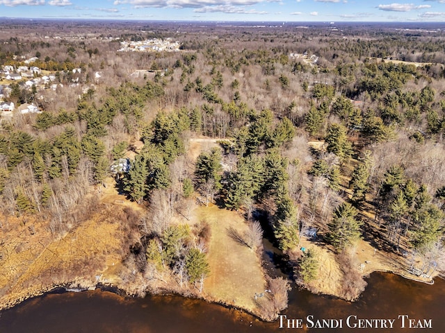 birds eye view of property with a wooded view