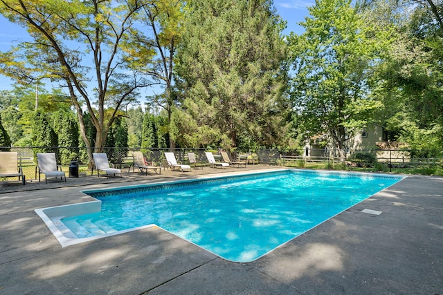 view of pool with a fenced in pool, a patio, and fence