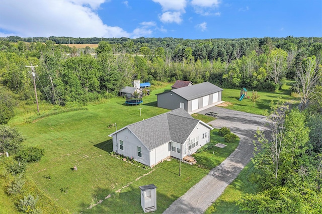 drone / aerial view with a view of trees