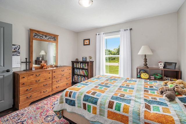 bedroom with wood finished floors