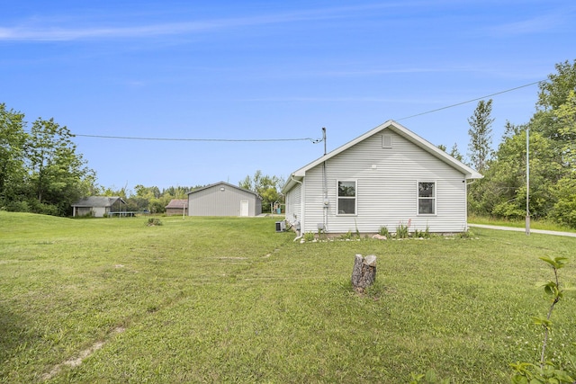 view of side of home featuring a lawn