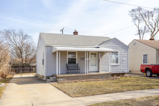 bungalow with a shingled roof, fence, a porch, a chimney, and a gate