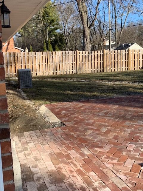 view of patio / terrace with cooling unit and fence