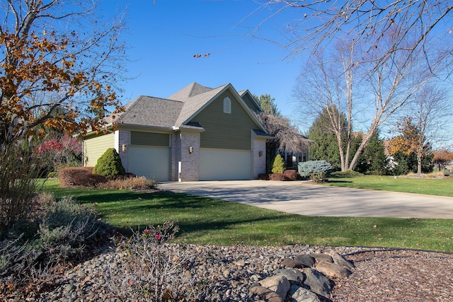 view of home's exterior featuring a lawn, concrete driveway, an attached garage, a shingled roof, and brick siding