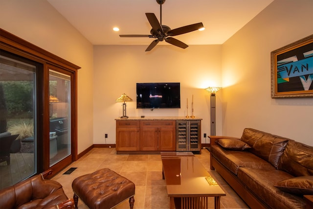 living room with light tile patterned floors, beverage cooler, visible vents, baseboards, and recessed lighting