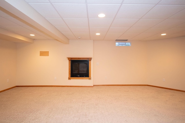 unfurnished room with light carpet, recessed lighting, a paneled ceiling, and baseboards