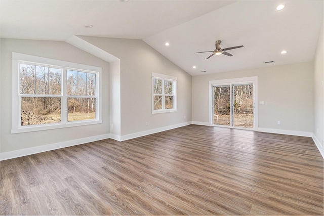 unfurnished living room with wood finished floors, recessed lighting, baseboards, ceiling fan, and vaulted ceiling