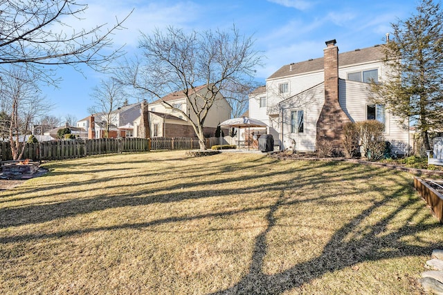 view of yard with a gazebo and fence