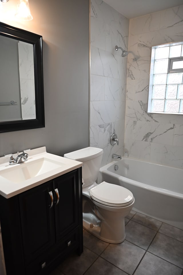 bathroom with shower / bathtub combination, toilet, and vanity