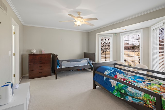 bedroom with a ceiling fan, baseboards, visible vents, ornamental molding, and light carpet