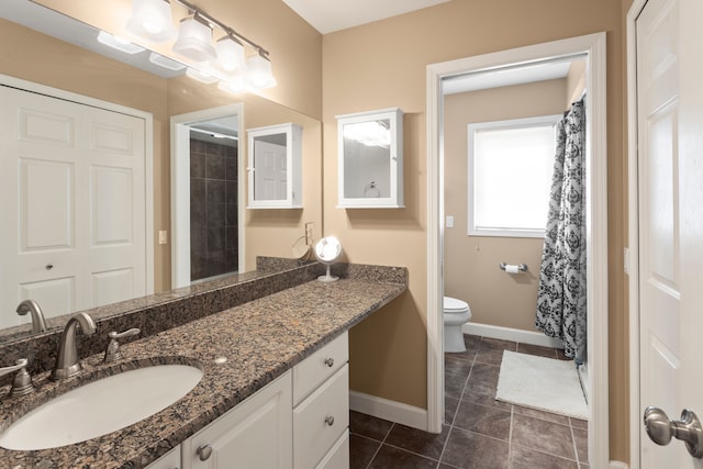 full bathroom with vanity, a shower with curtain, baseboards, tile patterned floors, and toilet