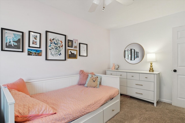 bedroom featuring a ceiling fan and light colored carpet