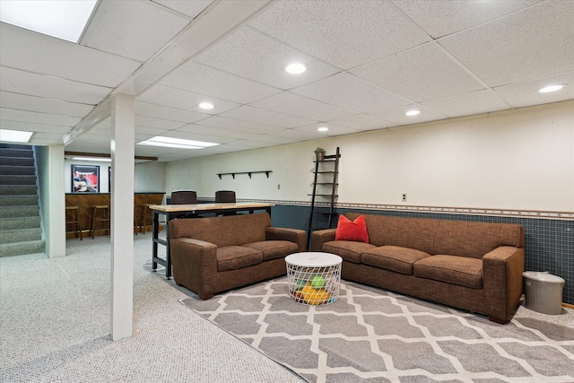 living room with stairs, recessed lighting, carpet floors, and wainscoting