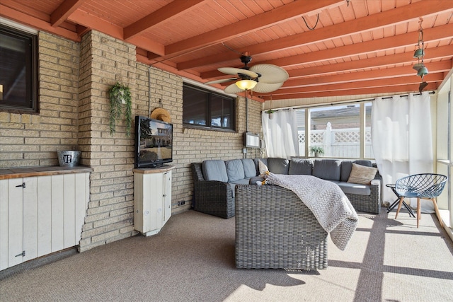 view of patio with an outdoor living space and a ceiling fan