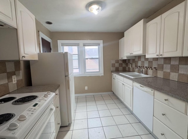 kitchen featuring a sink, tasteful backsplash, white appliances, white cabinets, and light tile patterned floors