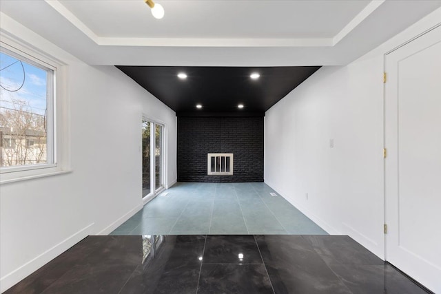 hallway with recessed lighting, baseboards, and tile patterned flooring