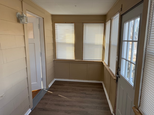 unfurnished sunroom featuring plenty of natural light