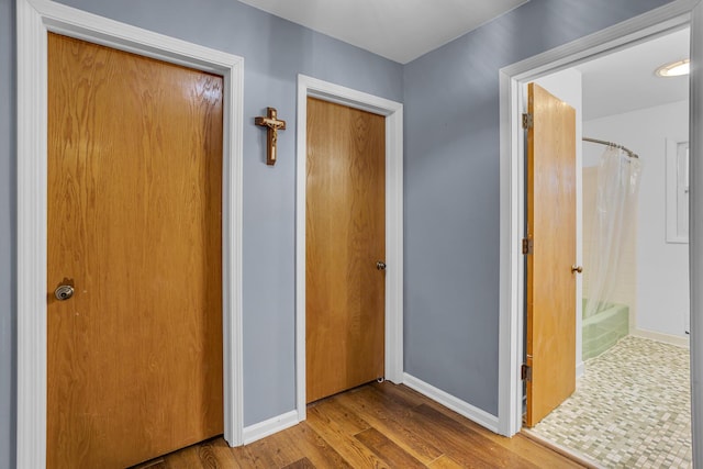 1307 Winston Dr, Jackson, MI 49203 - hall featuring baseboards and wood finished floors