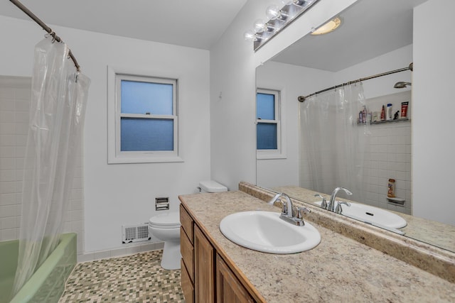 1307 Winston Dr, Jackson, MI 49203 - full bathroom with vanity, toilet, shower / bathtub combination with curtain, and visible vents