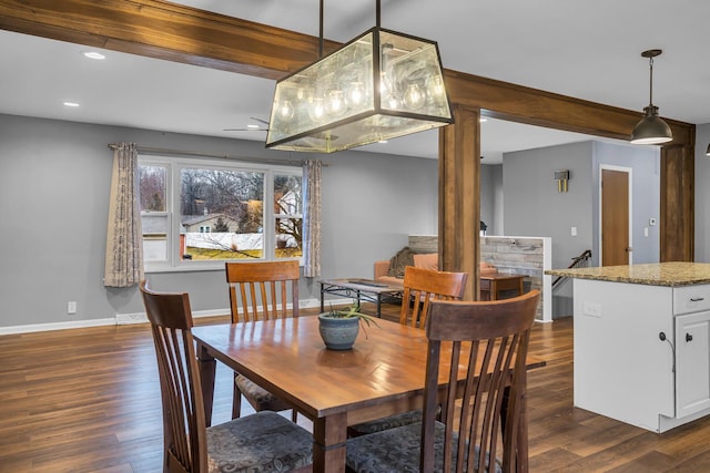 1307 Winston Dr, Jackson, MI 49203 - dining space with baseboards, dark wood-type flooring, and beam ceiling
