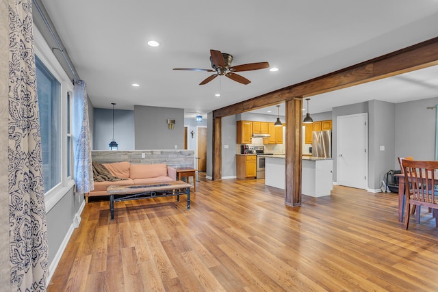 1307 Winston Dr, Jackson, MI 49203 - living room featuring recessed lighting, light wood-style flooring, and baseboards