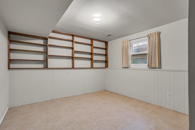 1307 Winston Dr, Jackson, MI 49203 - empty room featuring a wainscoted wall and visible vents