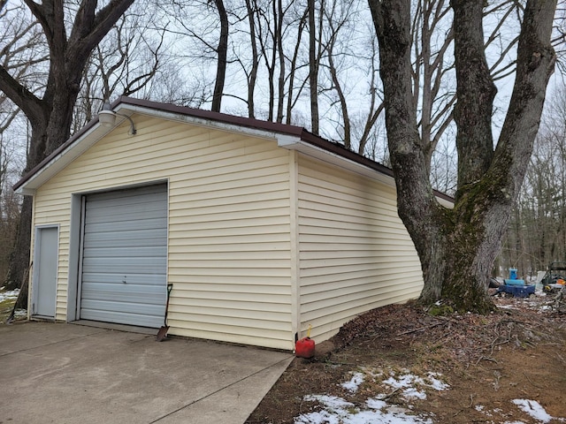 detached garage with concrete driveway