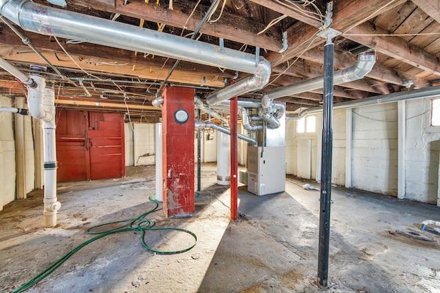 basement featuring heating unit