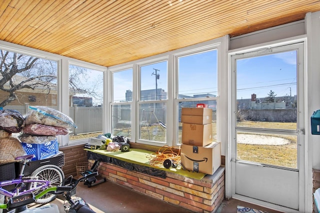 sunroom featuring wood ceiling