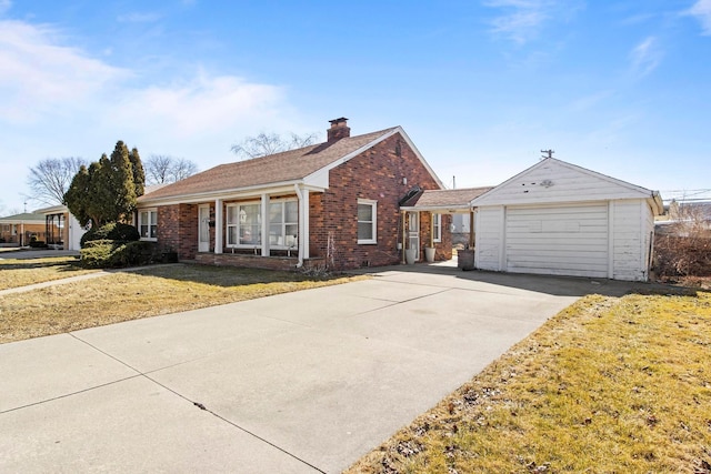 ranch-style home with brick siding, a front lawn, concrete driveway, a chimney, and an attached garage