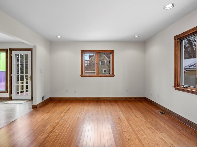 unfurnished room with recessed lighting, visible vents, baseboards, and light wood-style floors