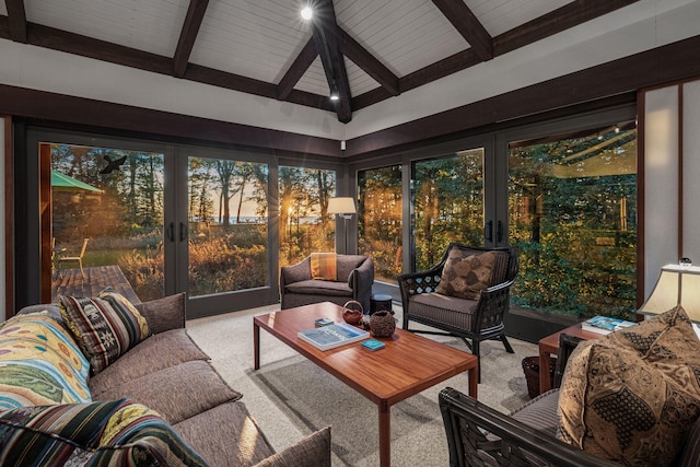 sunroom with beamed ceiling and french doors