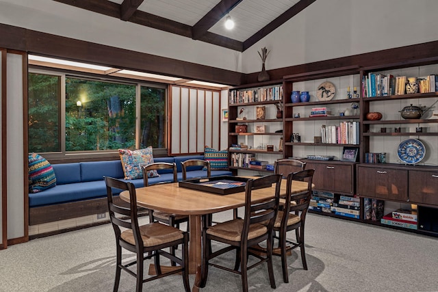 dining room with wooden ceiling, vaulted ceiling with beams, and carpet