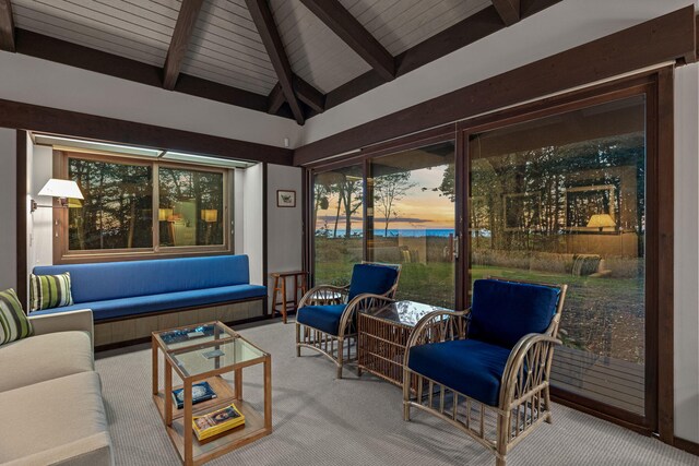 sunroom with vaulted ceiling with beams