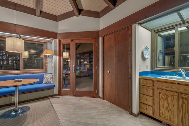 interior space featuring vanity, beam ceiling, and visible vents