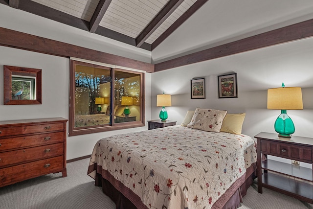 bedroom featuring carpet flooring, vaulted ceiling with beams, and baseboards